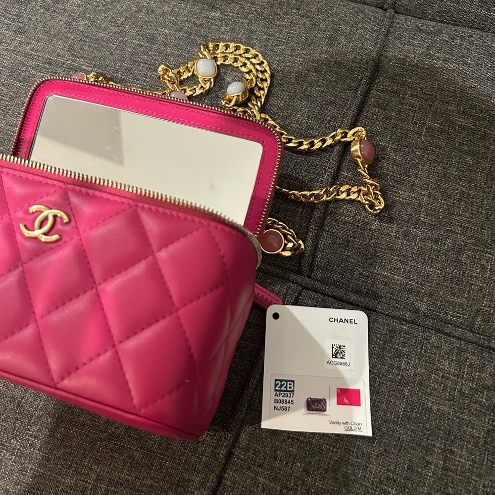 Fuchsia chanel vanity with charms and gold hardware